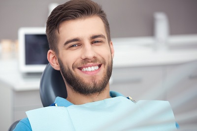 Man smiling in Rochester NY dental checkup